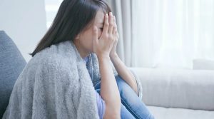 体調不良の女性